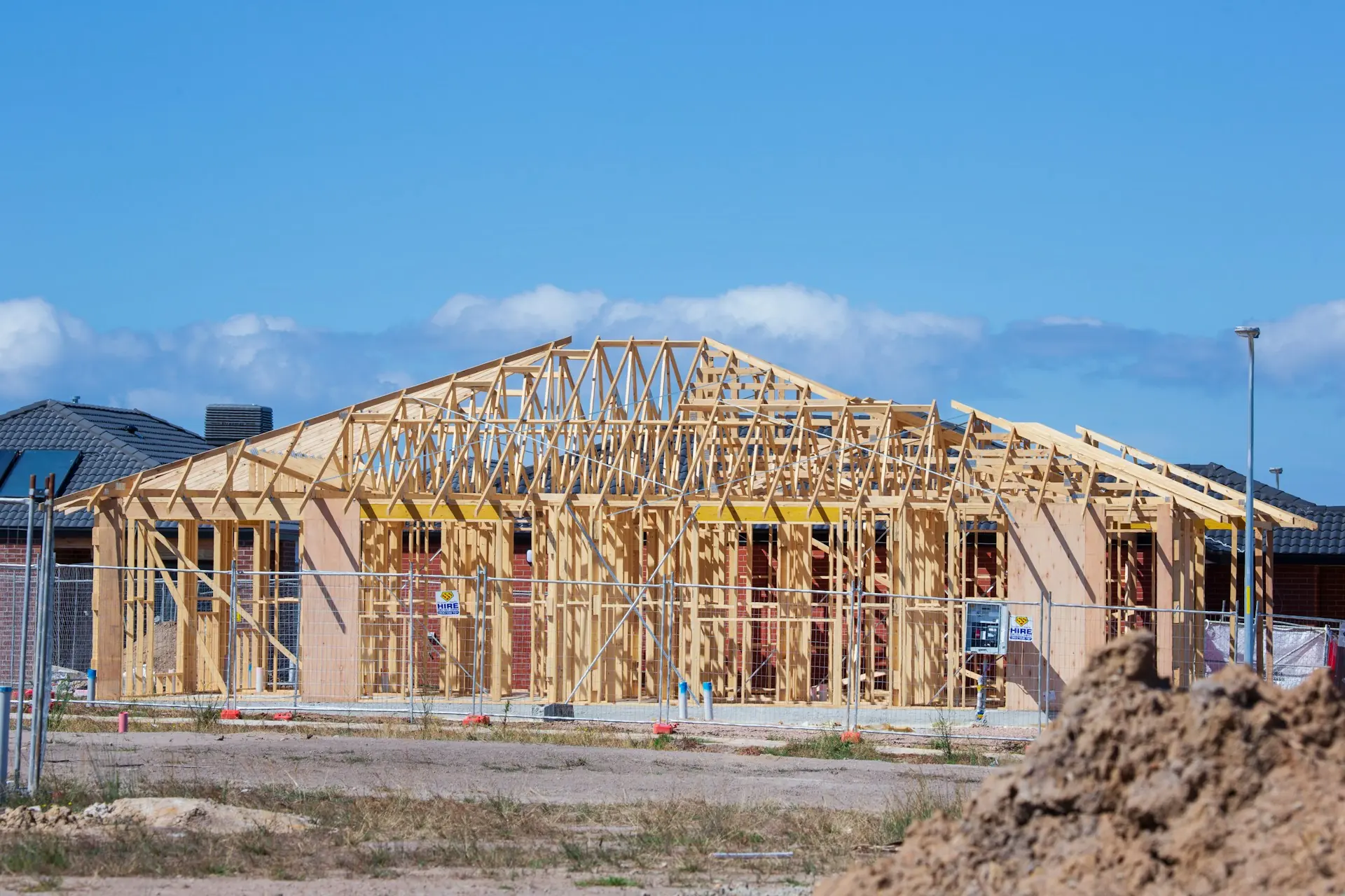 Framed house with trusses set on a job site