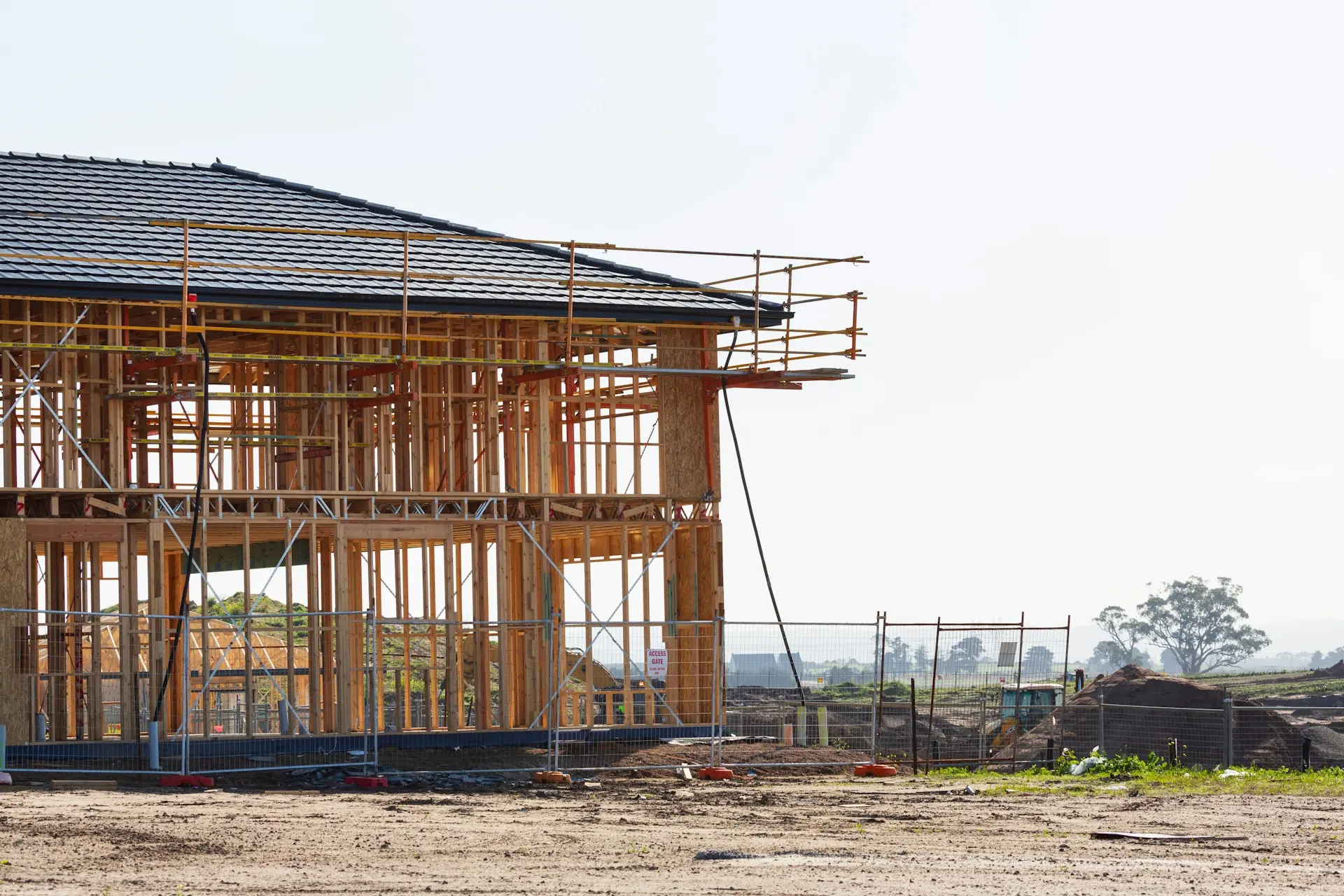 Two-story house framed on an open site